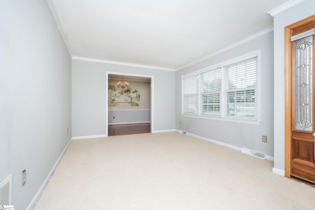 carpeted empty room with crown molding and a notable chandelier