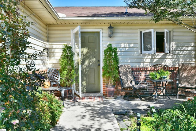 doorway to property with a patio