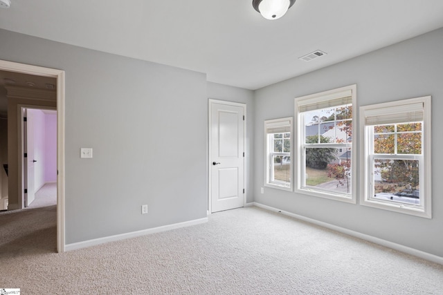 unfurnished room featuring carpet floors