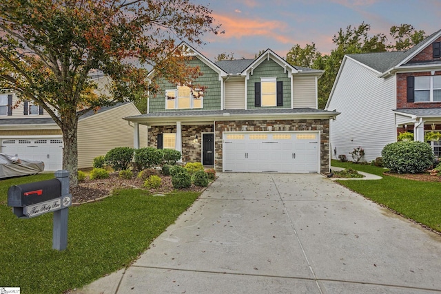 craftsman-style house with a lawn and a garage