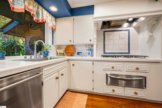 kitchen with white cabinetry, stainless steel appliances, sink, and dark hardwood / wood-style flooring