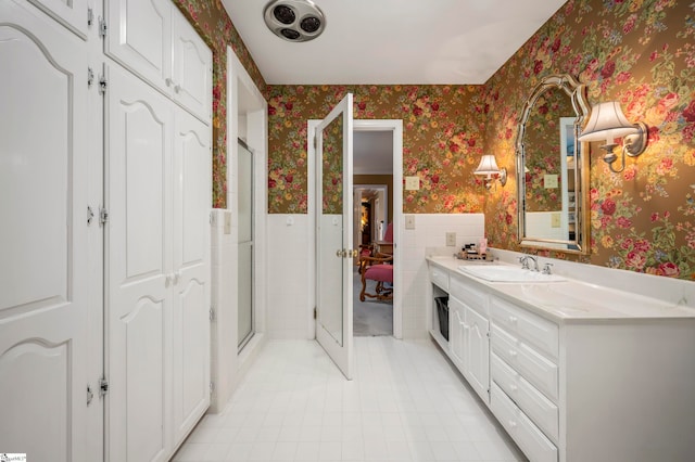 bathroom with vanity and walk in shower