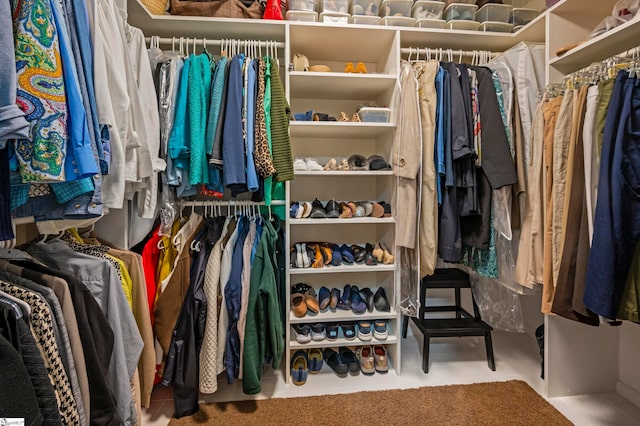 spacious closet with tile patterned floors