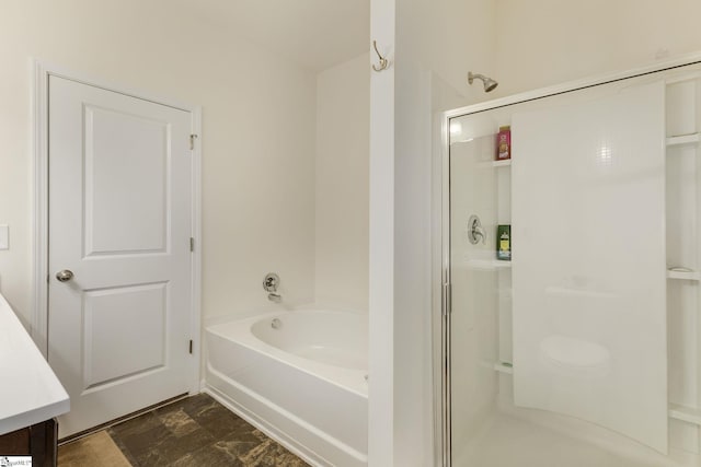 bathroom featuring vanity and shower with separate bathtub