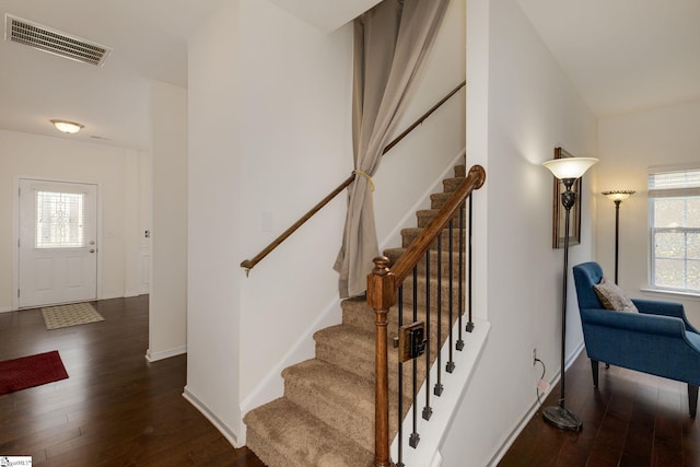 stairs with hardwood / wood-style floors