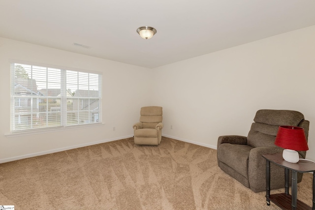 living area featuring carpet flooring