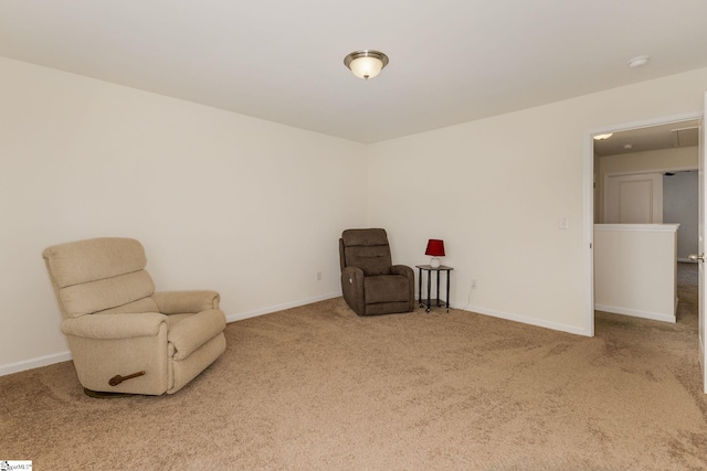 sitting room with carpet flooring