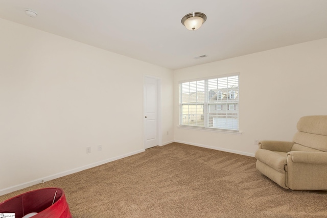 living area featuring carpet floors