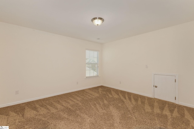 unfurnished room featuring carpet flooring