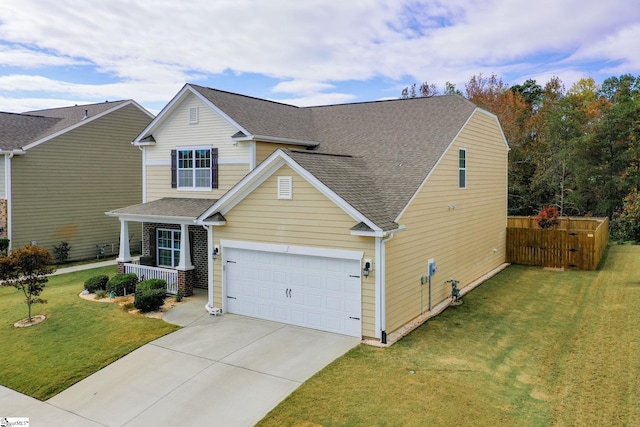 view of front of property featuring a garage and a front lawn