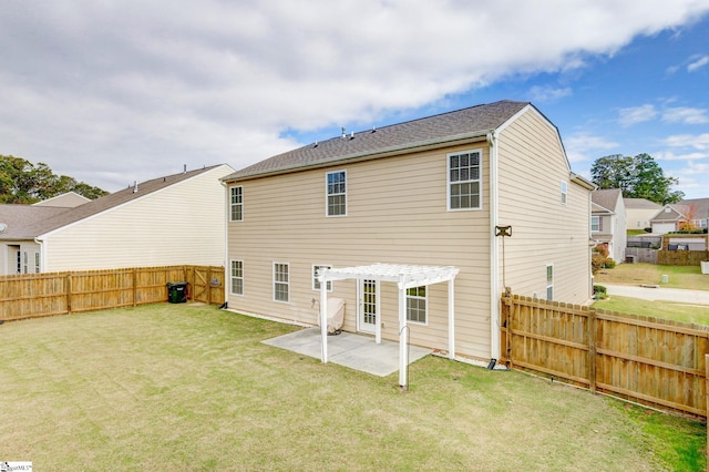 rear view of house with a pergola, a patio area, and a lawn