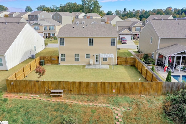 rear view of house with a lawn, a patio, and central AC unit