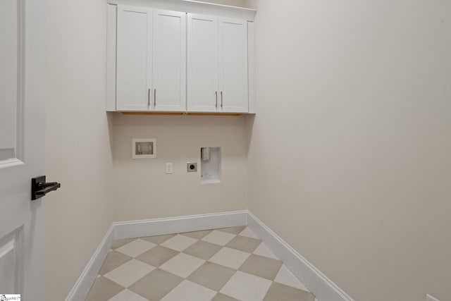 laundry area featuring washer hookup, electric dryer hookup, and cabinets