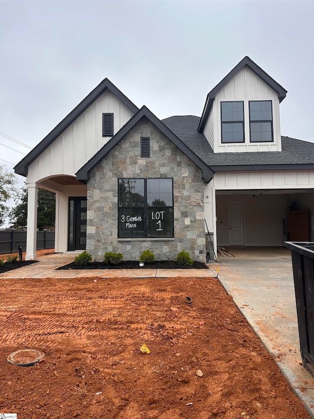 modern farmhouse featuring a garage