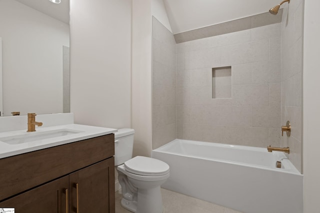 full bathroom with vanity, toilet, tiled shower / bath combo, and vaulted ceiling