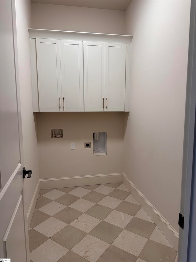 laundry area with hookup for a washing machine, cabinets, and hookup for an electric dryer