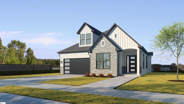 view of front facade with a front yard and a garage