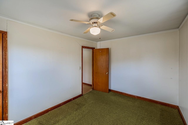 carpeted empty room featuring crown molding and ceiling fan