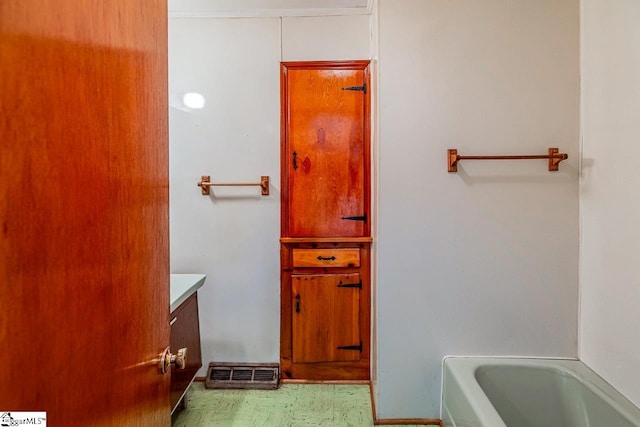 bathroom featuring vanity and a bathing tub