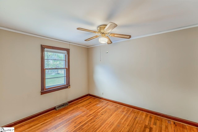 unfurnished room featuring light hardwood / wood-style floors, ornamental molding, and ceiling fan