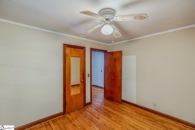 spare room featuring ornamental molding, light hardwood / wood-style flooring, and ceiling fan