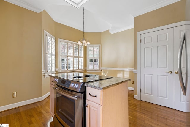 kitchen with light brown cabinets, wood-type flooring, ornamental molding, stainless steel range with electric stovetop, and decorative light fixtures