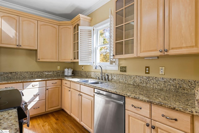 kitchen with light stone counters, appliances with stainless steel finishes, wood-type flooring, crown molding, and sink