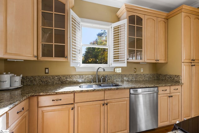 kitchen featuring light brown cabinetry, sink, stone countertops, and dishwasher