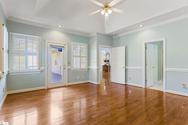 interior space featuring ornamental molding, light hardwood / wood-style flooring, access to exterior, and ceiling fan