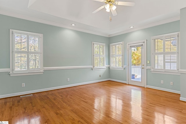 unfurnished room featuring ceiling fan, crown molding, and light hardwood / wood-style flooring