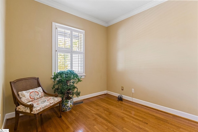 unfurnished room featuring crown molding and hardwood / wood-style flooring