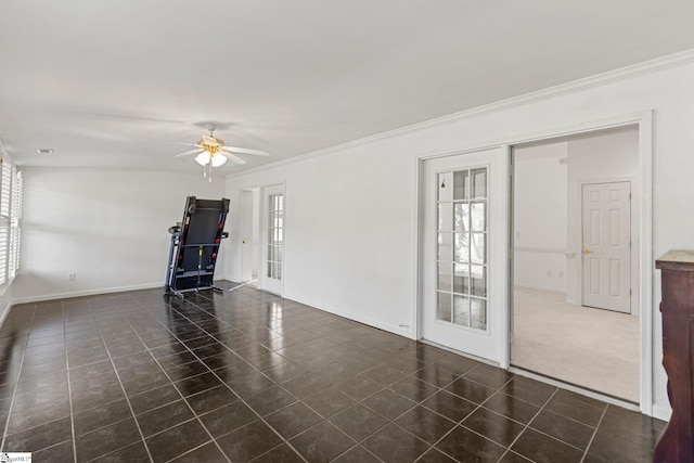 carpeted empty room with crown molding and ceiling fan