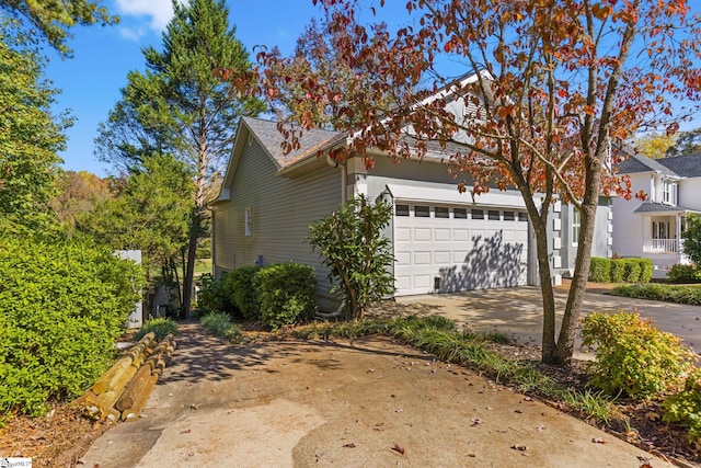 view of side of property featuring a garage