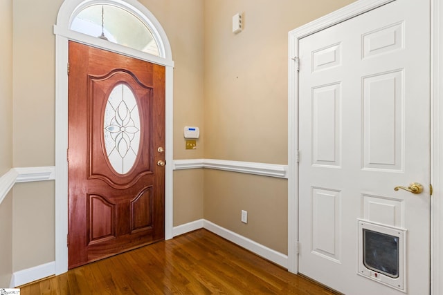 entryway with dark hardwood / wood-style floors