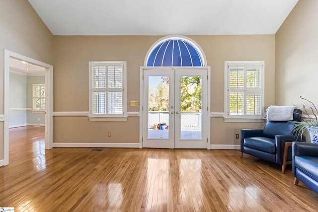 doorway with french doors and wood-type flooring