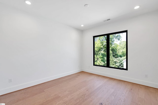 unfurnished room featuring light hardwood / wood-style floors