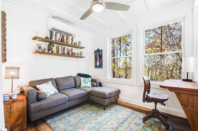 home office featuring an AC wall unit, coffered ceiling, hardwood / wood-style flooring, and ceiling fan