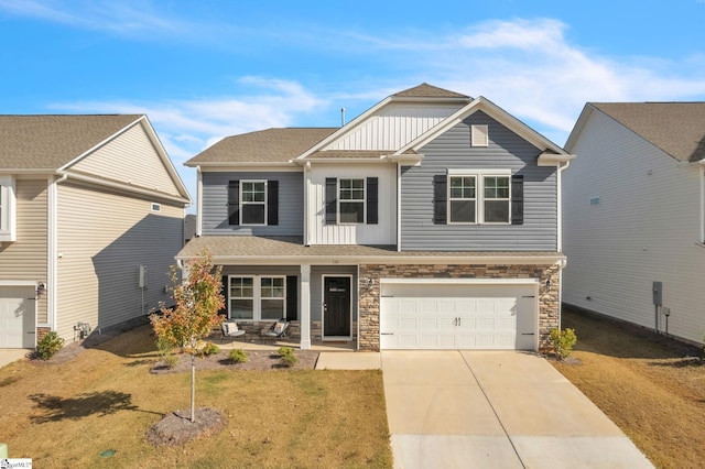 view of front of property featuring a front lawn and a garage