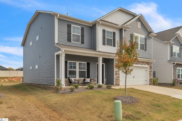 craftsman house with a garage, a front lawn, and a porch