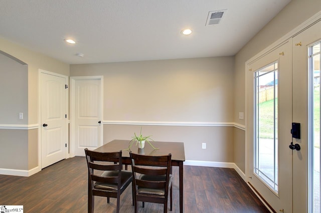 dining room featuring dark wood-type flooring