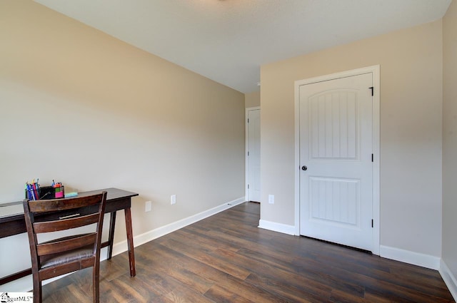 office with dark wood-type flooring