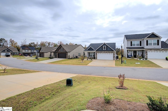 view of front of home featuring a front lawn and a garage