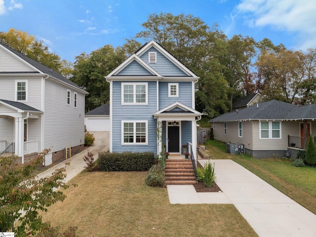 view of front of home with a porch, cooling unit, and a front yard