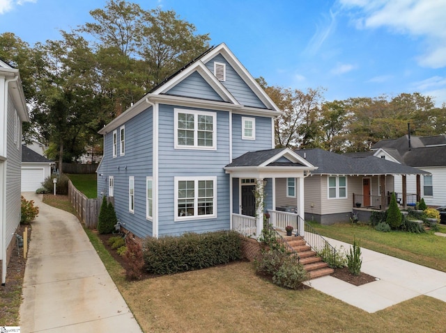 view of front of house with a front lawn and covered porch