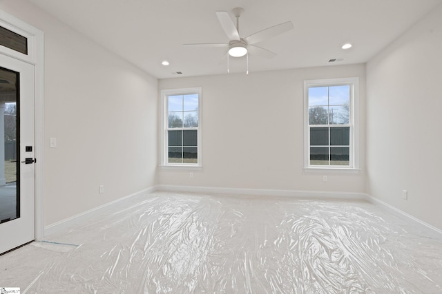 unfurnished room with ceiling fan