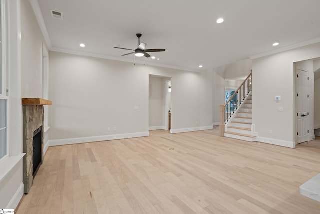 unfurnished living room featuring ceiling fan, light hardwood / wood-style floors, and ornamental molding