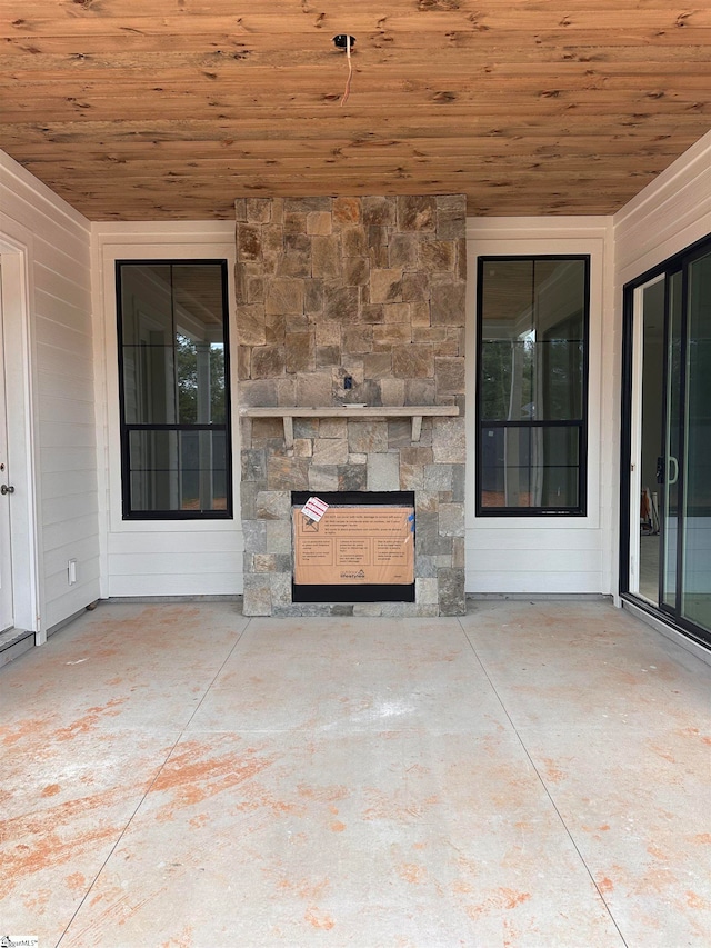 view of patio featuring a fireplace