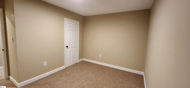 empty room with carpet flooring