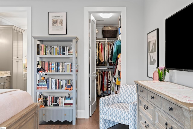 bedroom with hardwood / wood-style flooring and a closet