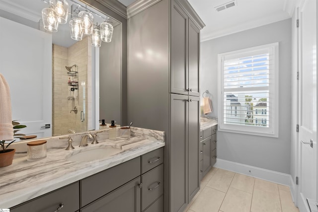 bathroom featuring tile patterned floors, crown molding, and a shower with shower door